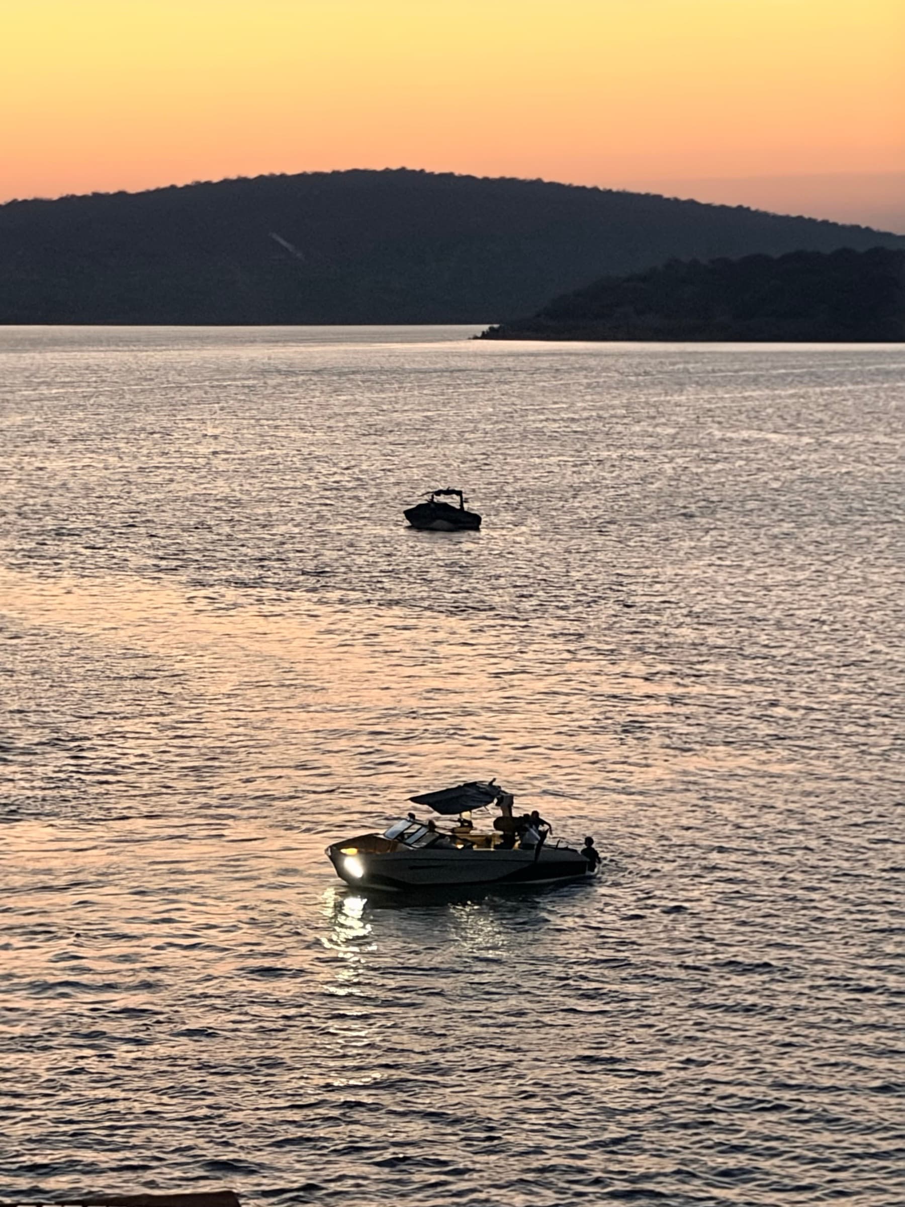 The Xtreme Gene boat returning across the lake in the evening light